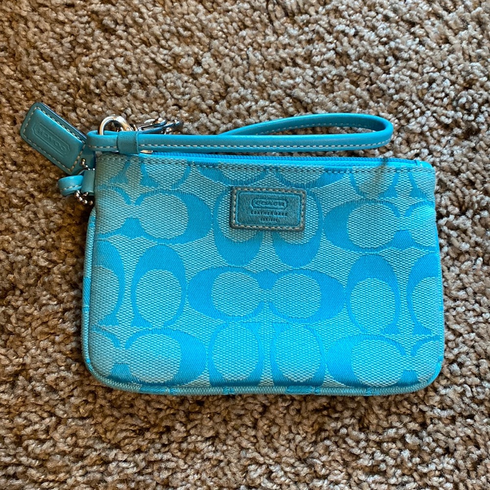 Bright blue Coach wristlet.